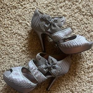 Silver heels with rhinestone bow